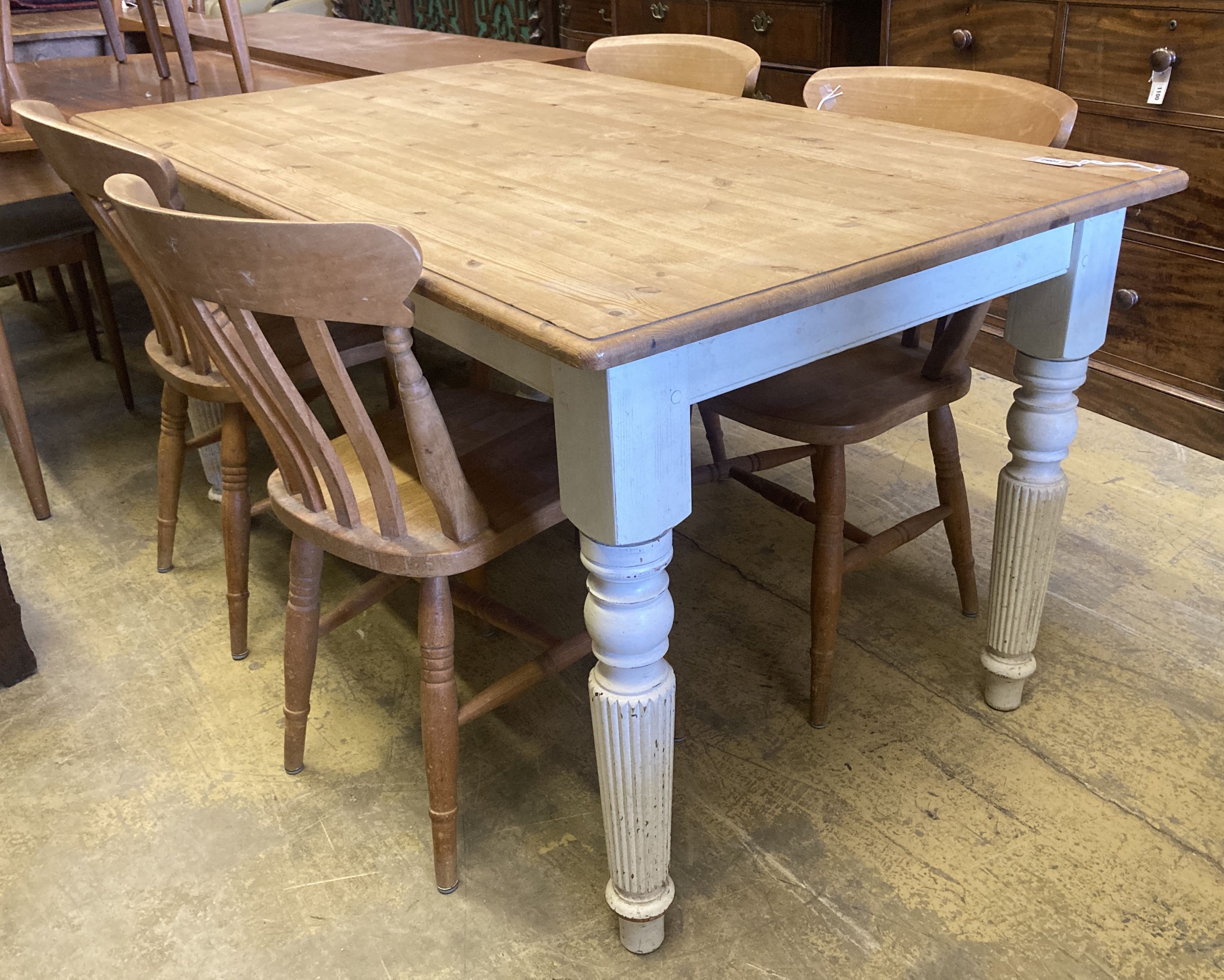 A Victorian style rectangular painted pine kitchen table, length 150cm, depth 90cm, height 79cm and four Windsor beech lathe back kitch